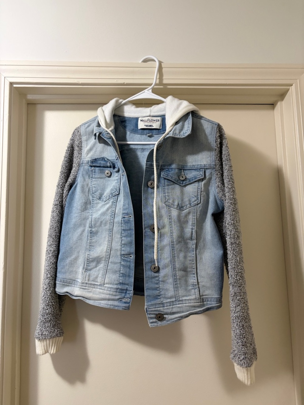 Light Wash Denim Jacket with Gray Knit Sleeves and White Hooded Trim